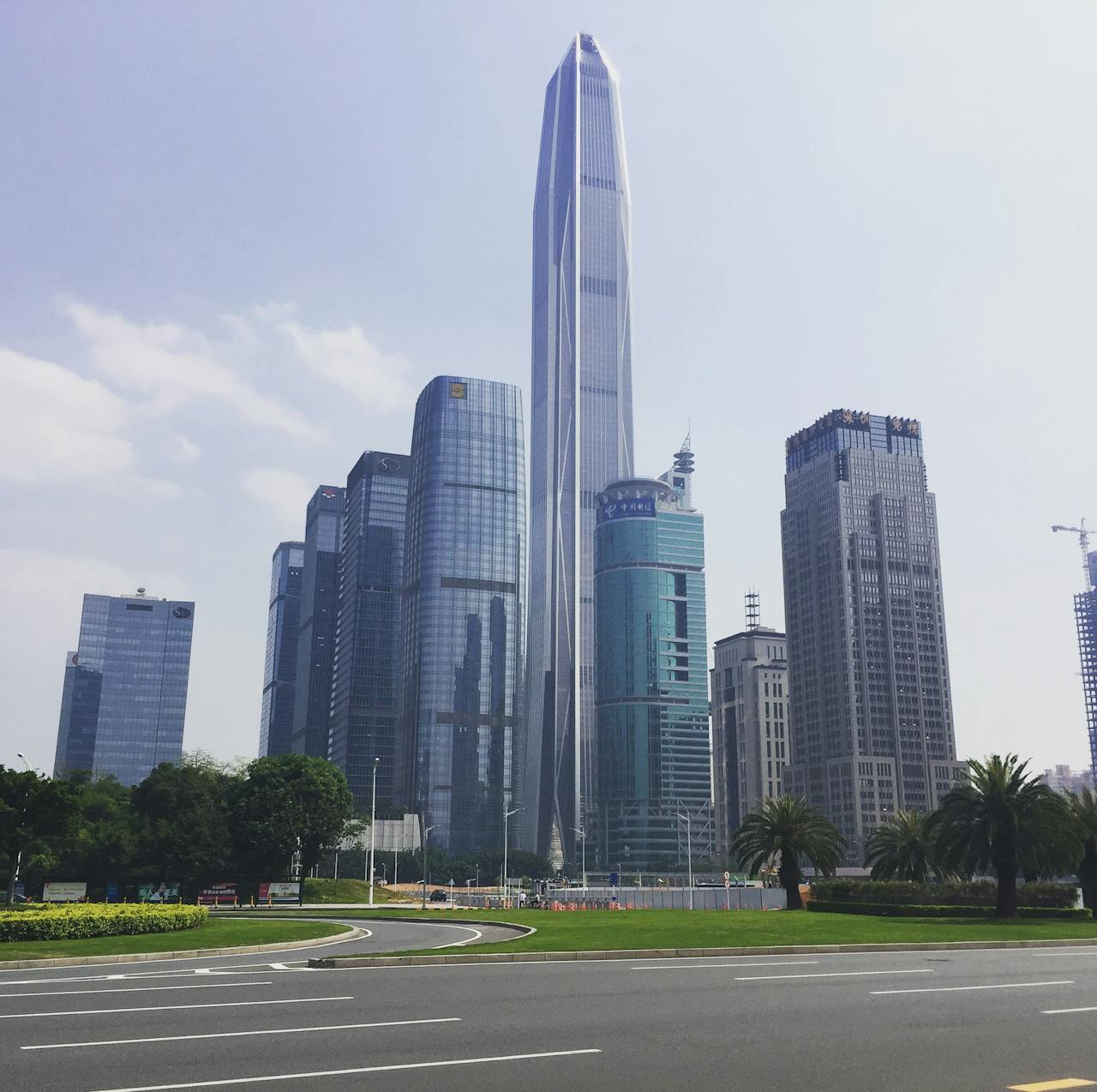 About Modern skyscrapers in Shenzhens downtown showcasing futuristic architecture under clear skies.